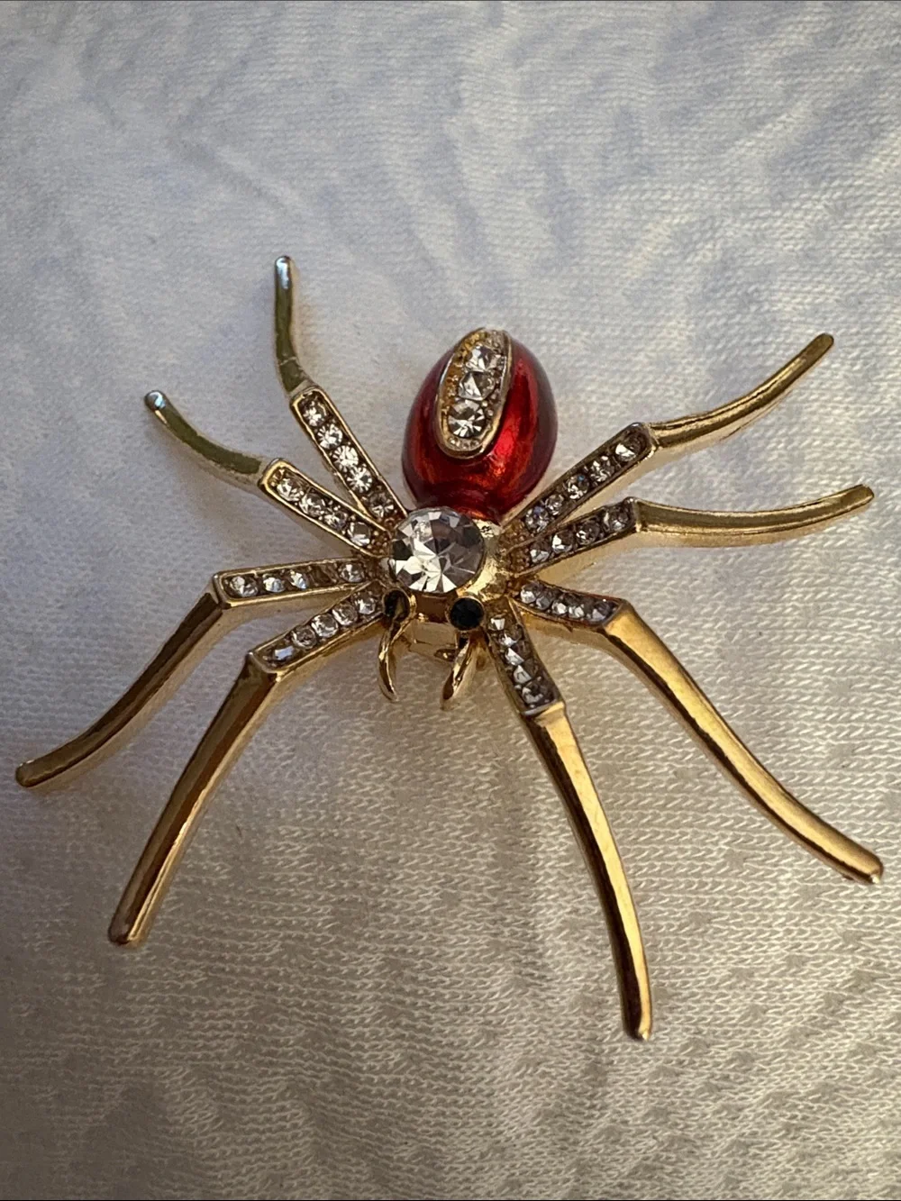 Gold-tone Spider Brooch with Red Accent and Clear Crystals